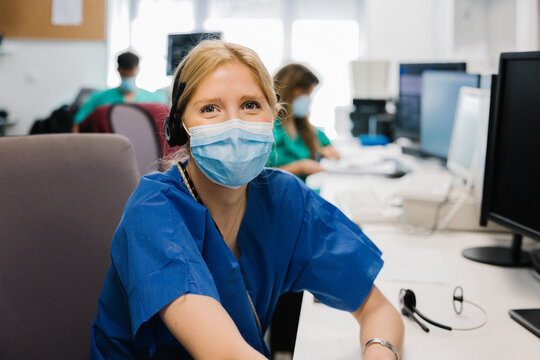 Positive female doctor in mask
