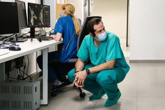Doctors examining patient x ray