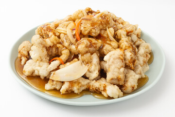 Sweet and sour pork on a white background