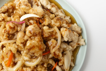 Sweet and sour pork on a white background