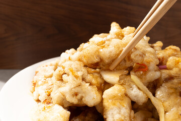 Chinese food with fried pork and sweet and sour sauce