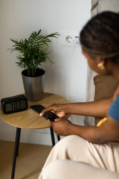 Woman Charging Her Mobile Phone 