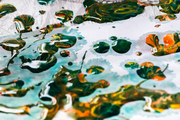 Closeup of colorful oil paint splashes on canvas. Abstract background