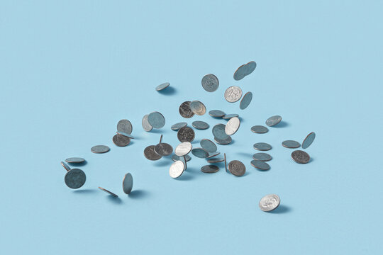 Quarter dollar coins on blue background.