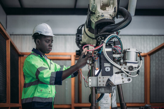 Mechatronic Student at Robotic Academy performs machine maintenance and technical adjustments.
