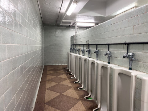 Empty toilet with ceramic urinals