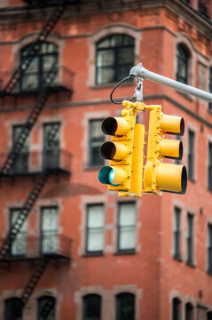 Hanging traffic signs from extended pole in city street