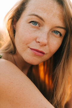 Close up portrait of a woman looking at camera