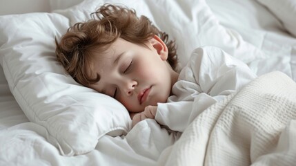 Young child sleeping peacefully in white bedding.