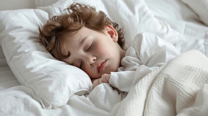 Obraz na płótnie Canvas Young child sleeping peacefully in white bedding.