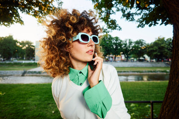 Portrait of a trendy woman talking on the phone