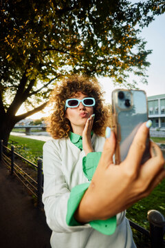 Influential trendy woman takes a selfie