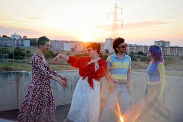 Diversity: colorful Gen Z friends dancing and having fun at sunset