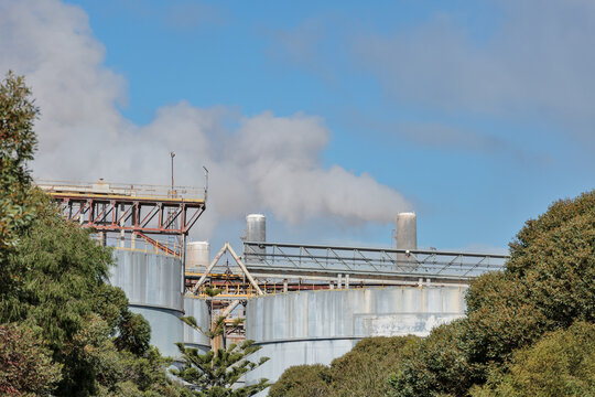 Large industrial refinery smoke stacks 