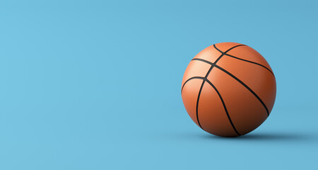 Basketball on blue background with copy space.