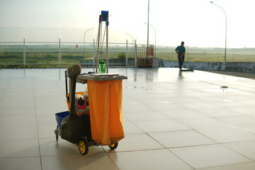 a worker cleaning airport floors