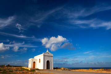 Small white catholics church, Chapel of Immaculate Conception on the seacost of Malta