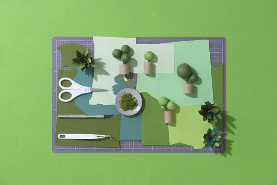 Art model with plants and pots. Flower made of paper