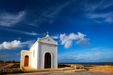 Small white catholics church, Chapel of Immaculate Conception on the seacost of Malta