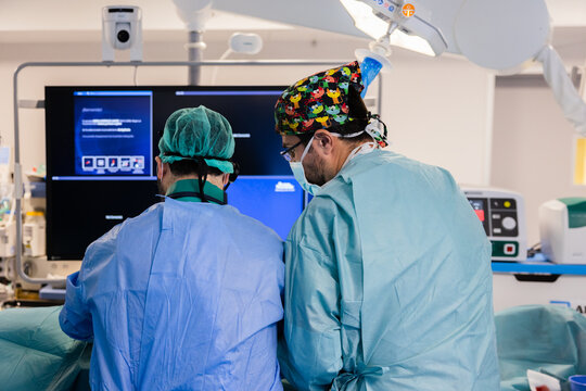Two doctors standing in hospital operating room