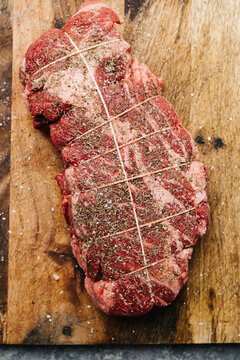 Tied and seasoned raw chuck roast