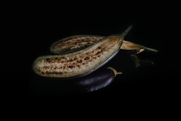 eggplants isolated on black or dark background