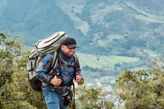Portrait of a paraglider from a mountaintop