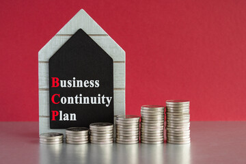 Business Continuity Plan symbol. Text Business Continuity Plan written on a black board. Silver...