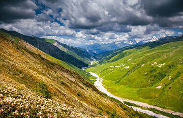 Breathtaking view of the Main Caucasus Range and green alpine meadows. Samegrelo-Zemo Svaneti, Georgia.