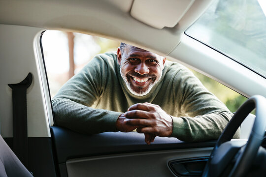 Happy man portrait in a car