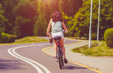 Cyclist ride on the bike path in the city Park
