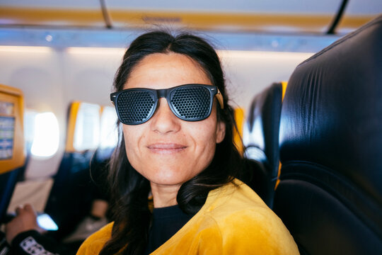 Woman with pinhole glasses