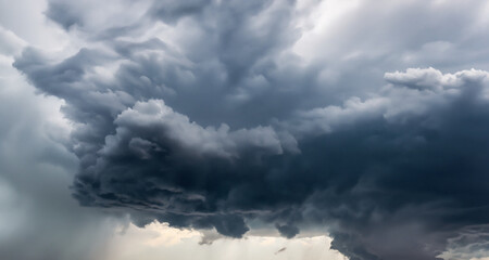Fototapeta na wymiar Heavy dark storm raining clouds over the sky