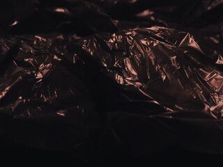 Brown plastic bag in dark for abstract background.     