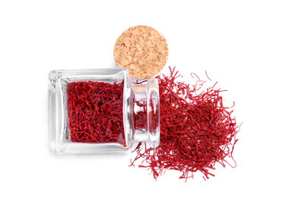 Aromatic saffron and glass jar isolated on white, top view