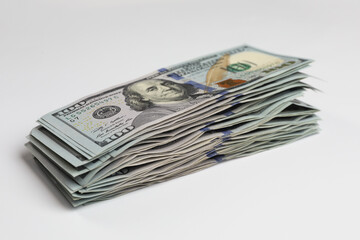 Money exchange. Dollar banknotes on white background, closeup