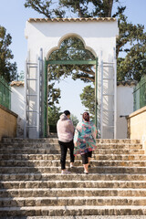 Caucasian women on the steps at the entrance to the Muslim mosqu