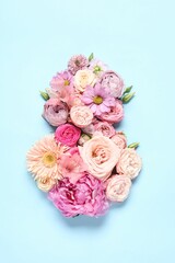 8 March greeting card design made with beautiful flowers on light blue background, top view