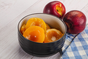 Canned peaches with sweet syrope