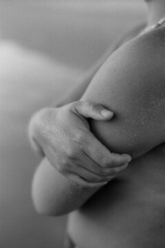 Hand and arm of an anonymous woman
