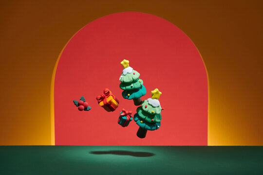 Merry Christmas with pine tree elements in color background
