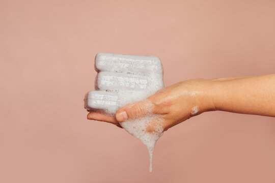 Woman Holding Soap Bars in Her Hand  