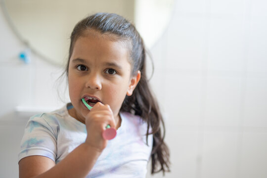Girl brushing her teeth