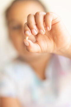 blurred girl showing her tooth