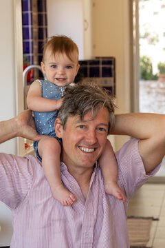 Father spending time with his baby at home