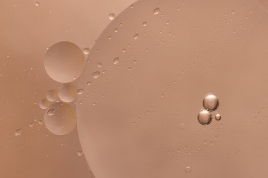 macro image of beauty serum with pink background