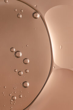 macro image of beauty serum with pink background