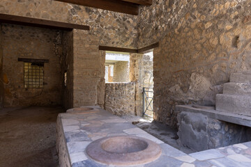 Thermopolium of Asellina, cook-shop in ruins of ancient city, Pompeii, Naples, Italy