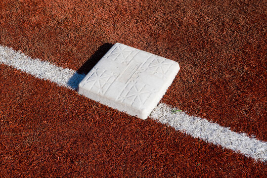 Detail of base on baseball field, close up