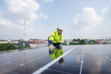 Engineers in helmets installing solar panel system outdoors. Installing a Solar Cell on a Roof. Solar panels on roof. Workers installing solar cell power plant eco technology.